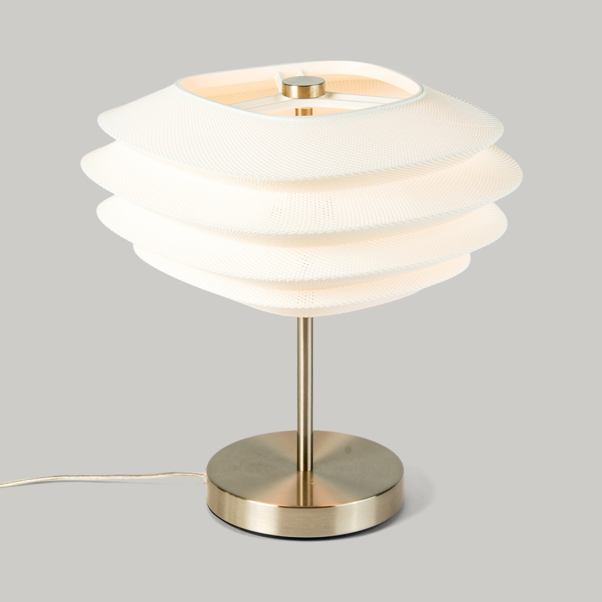 Arcas Lamp in Brass on white background