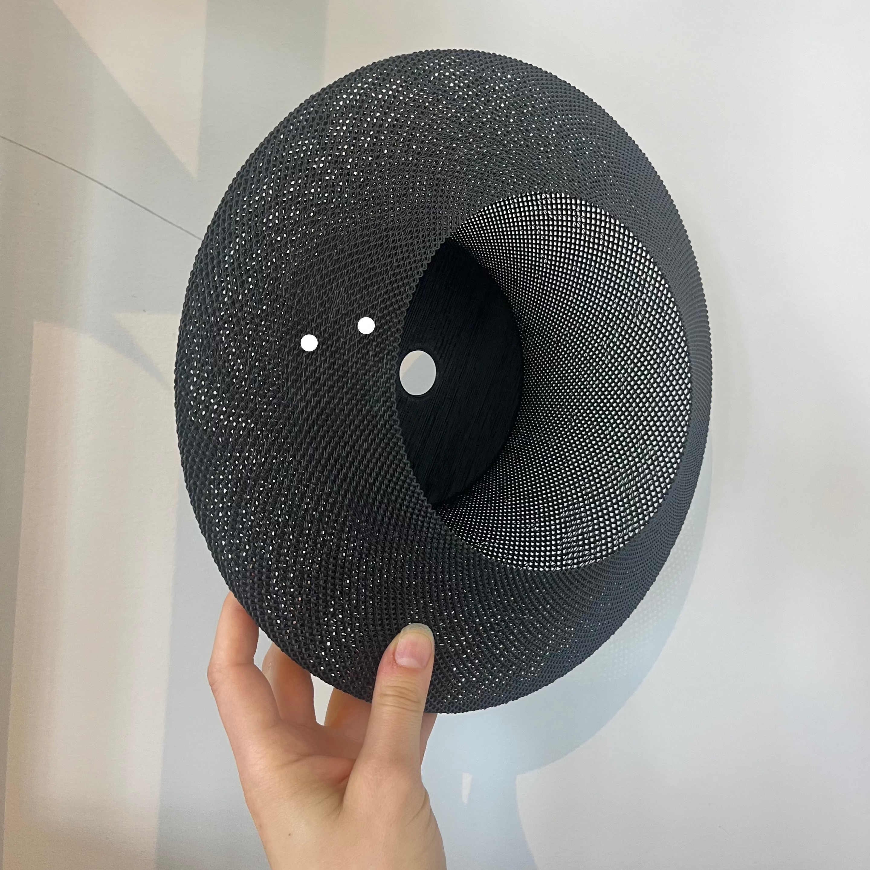 Helios Sconce shade in matte black with defect on white background