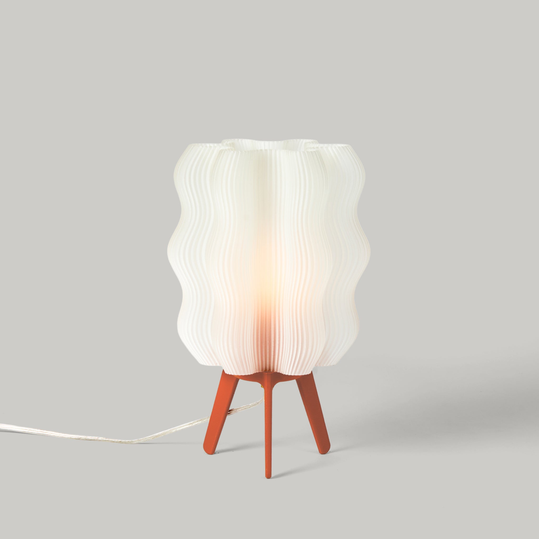 Wavy Lamp in vermillion on white background