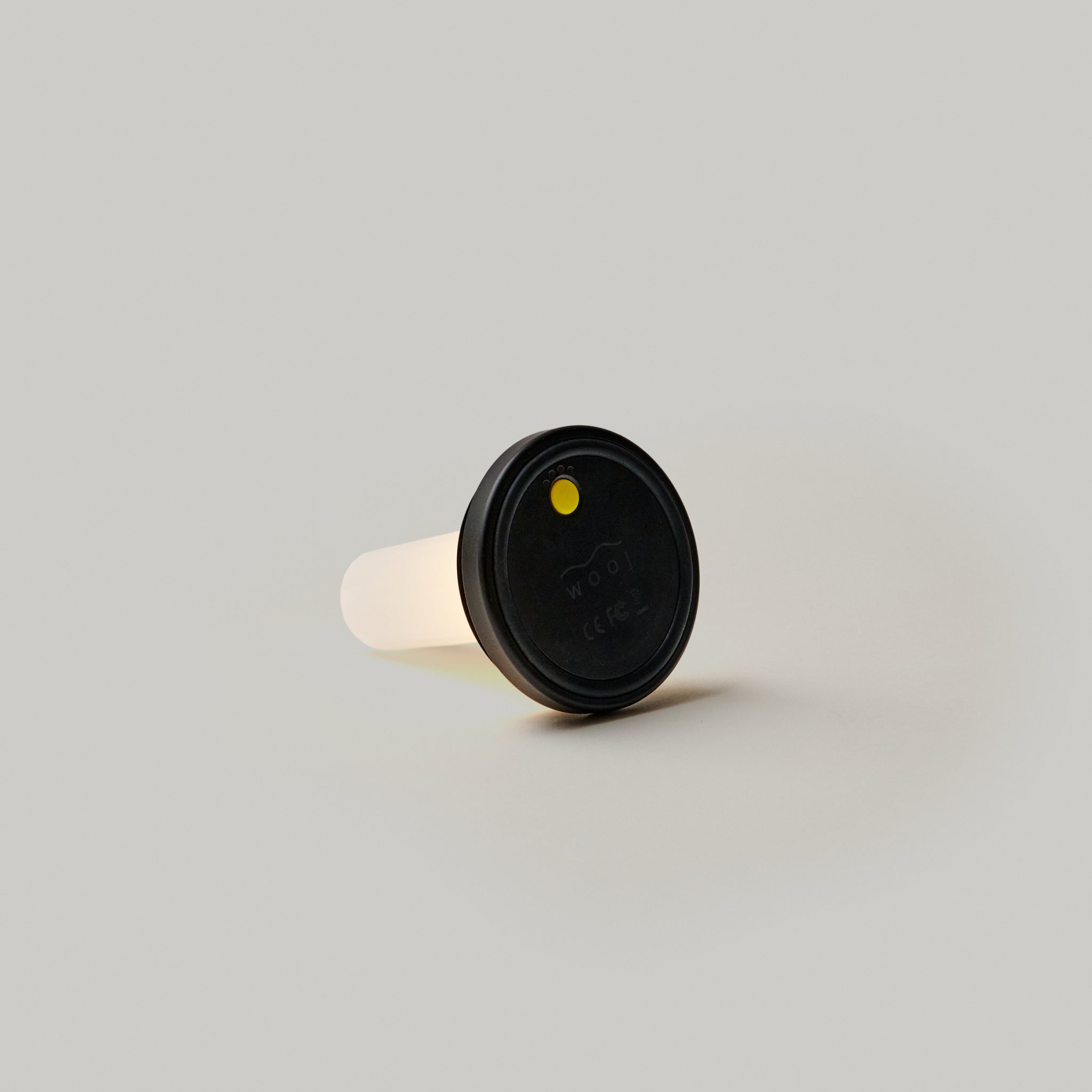 cordless base on its side on white background