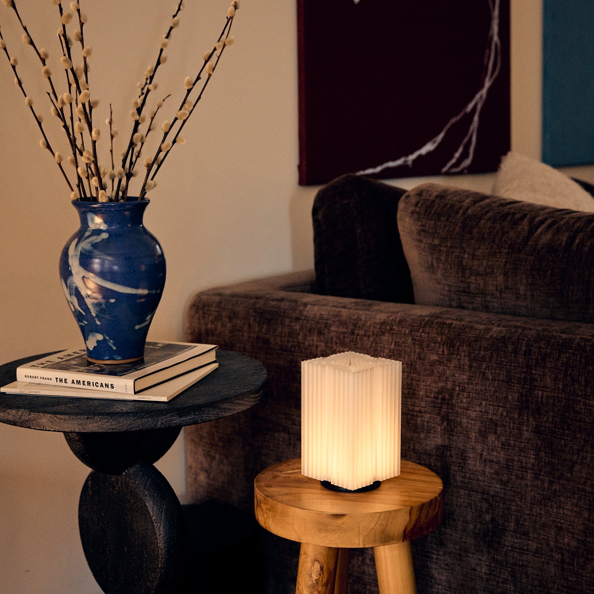 Cordless mini brut lamp in natural on stool 