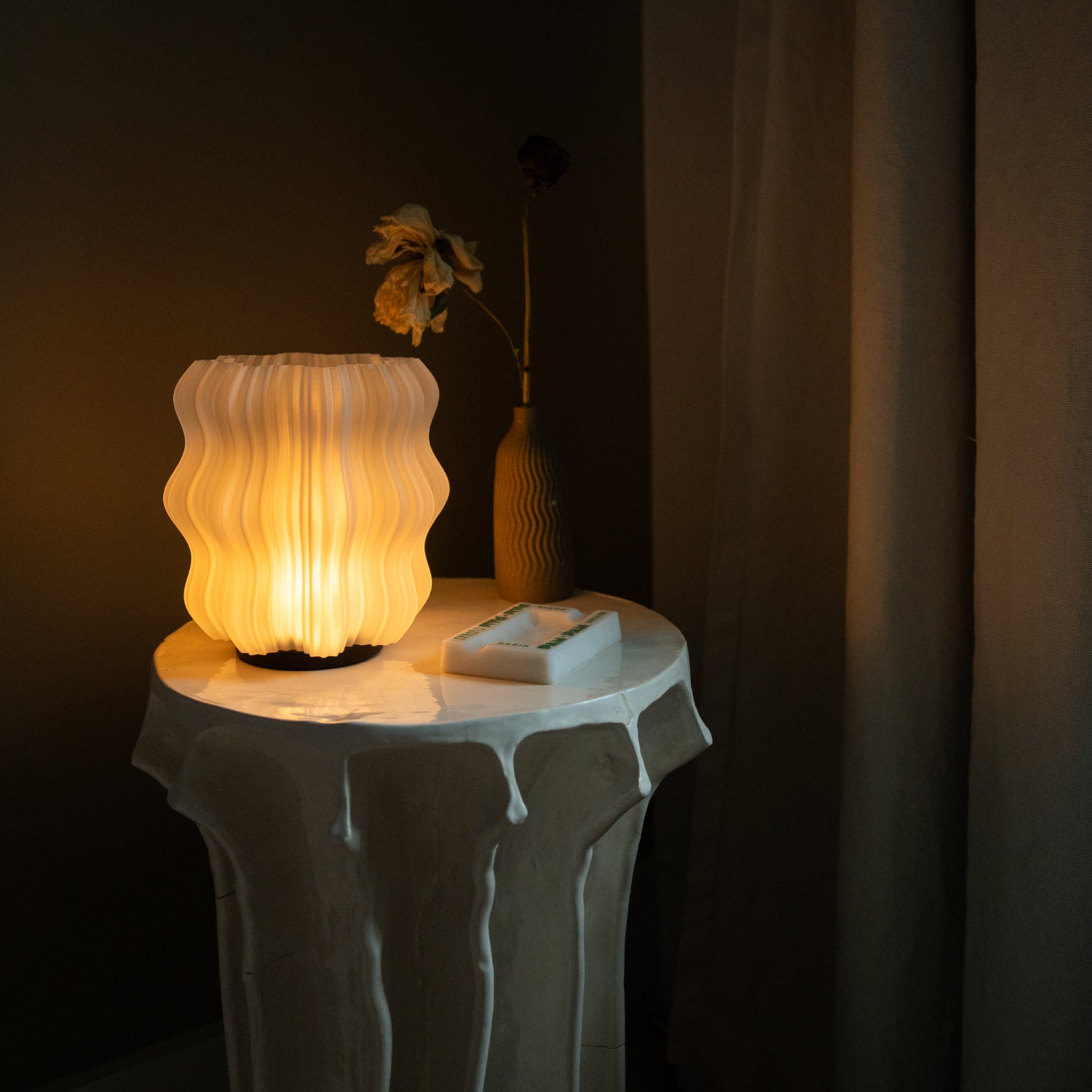 Cordless Mini Wavy Lamp on white table in bedroom