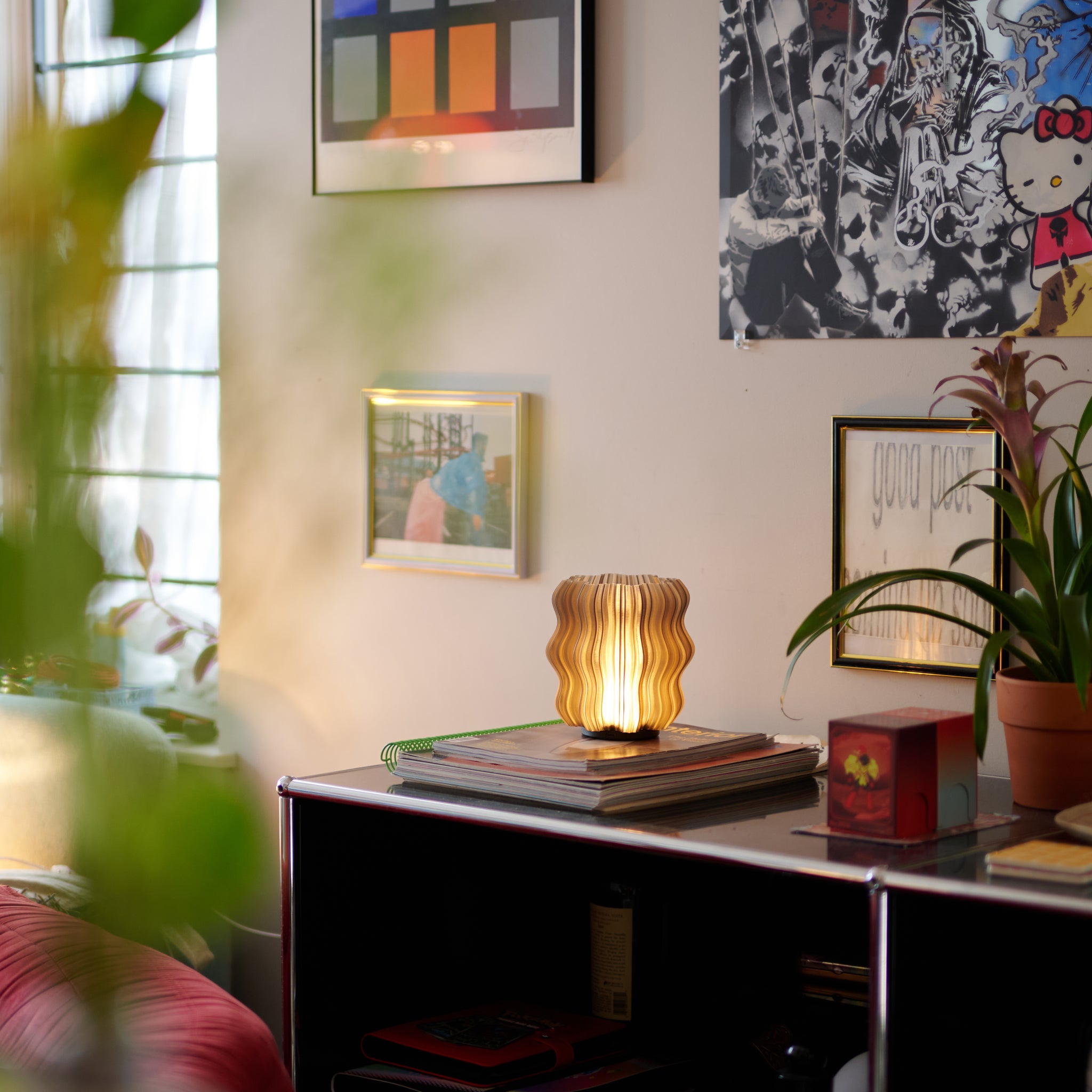 Mini Wavy Lamp in Smoke on stack of books
