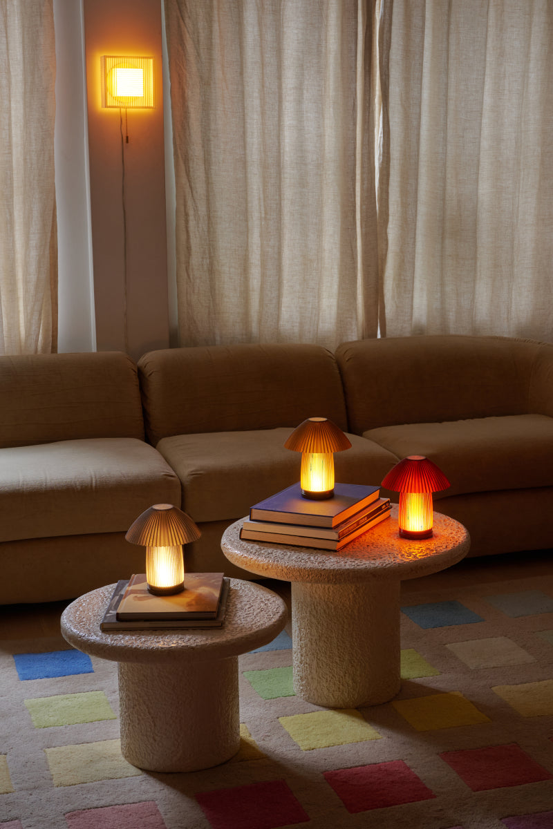 Cordless Kinoko Lamps in Amber, Smoke, and Olive Oil. Photo by Matthew Gordon.