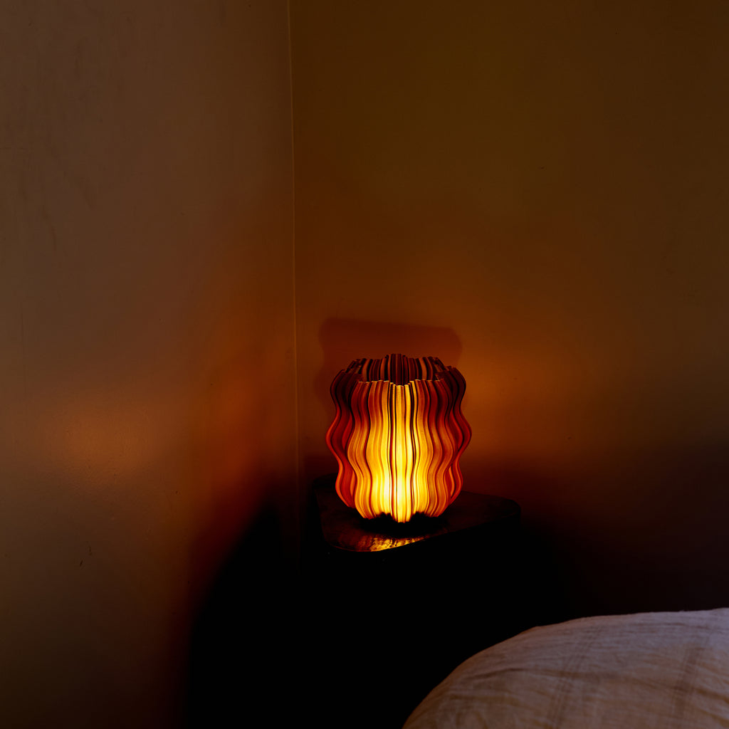 Mini Wavy Lamp in Amber on table