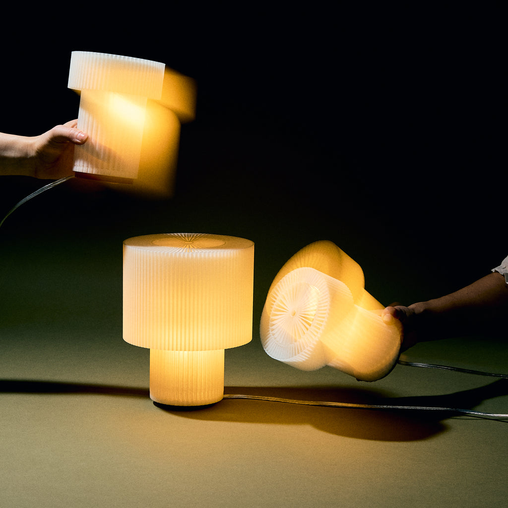 Image of multipled drum lamps with playful movement