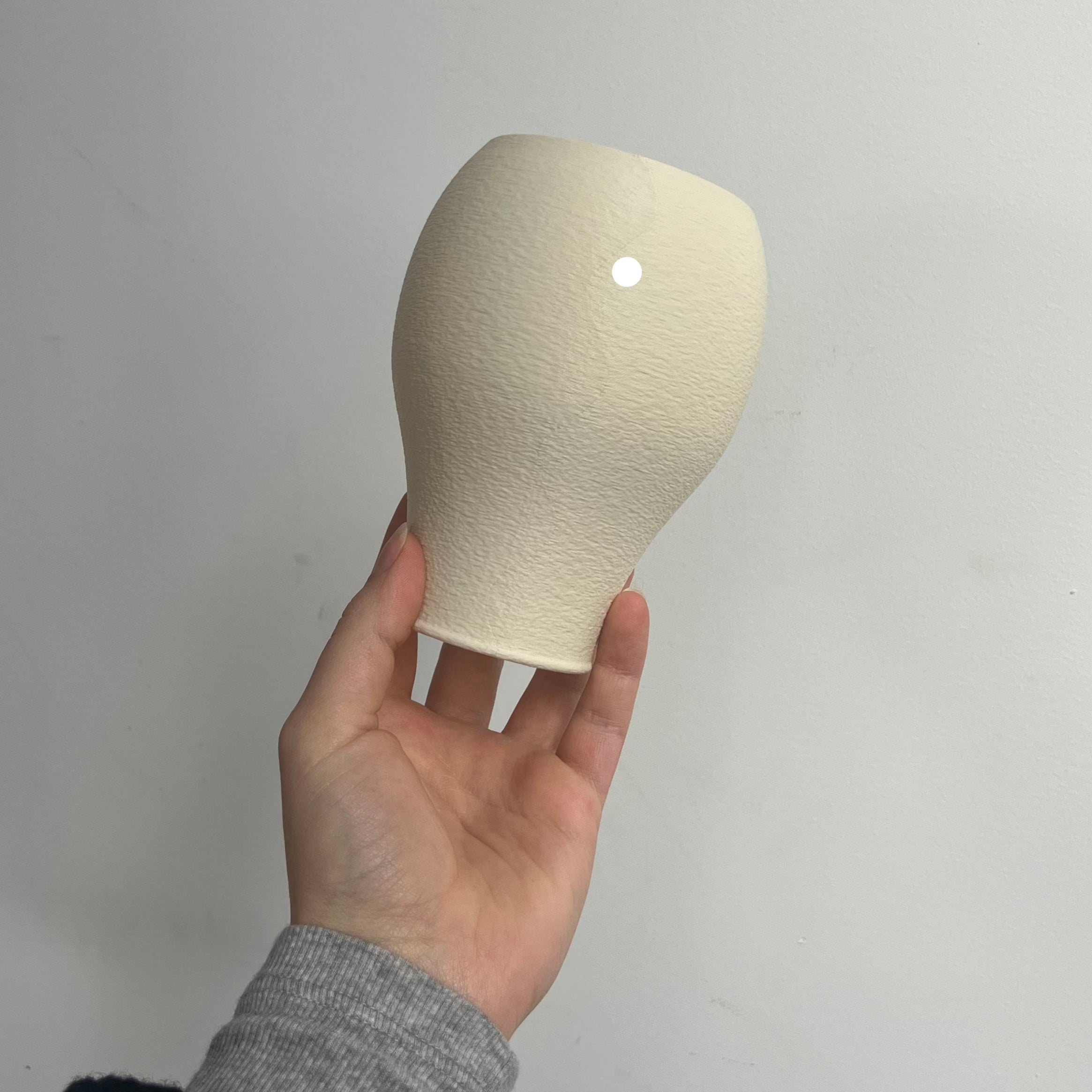 Scoop Lamp in eggshell with defect on white background