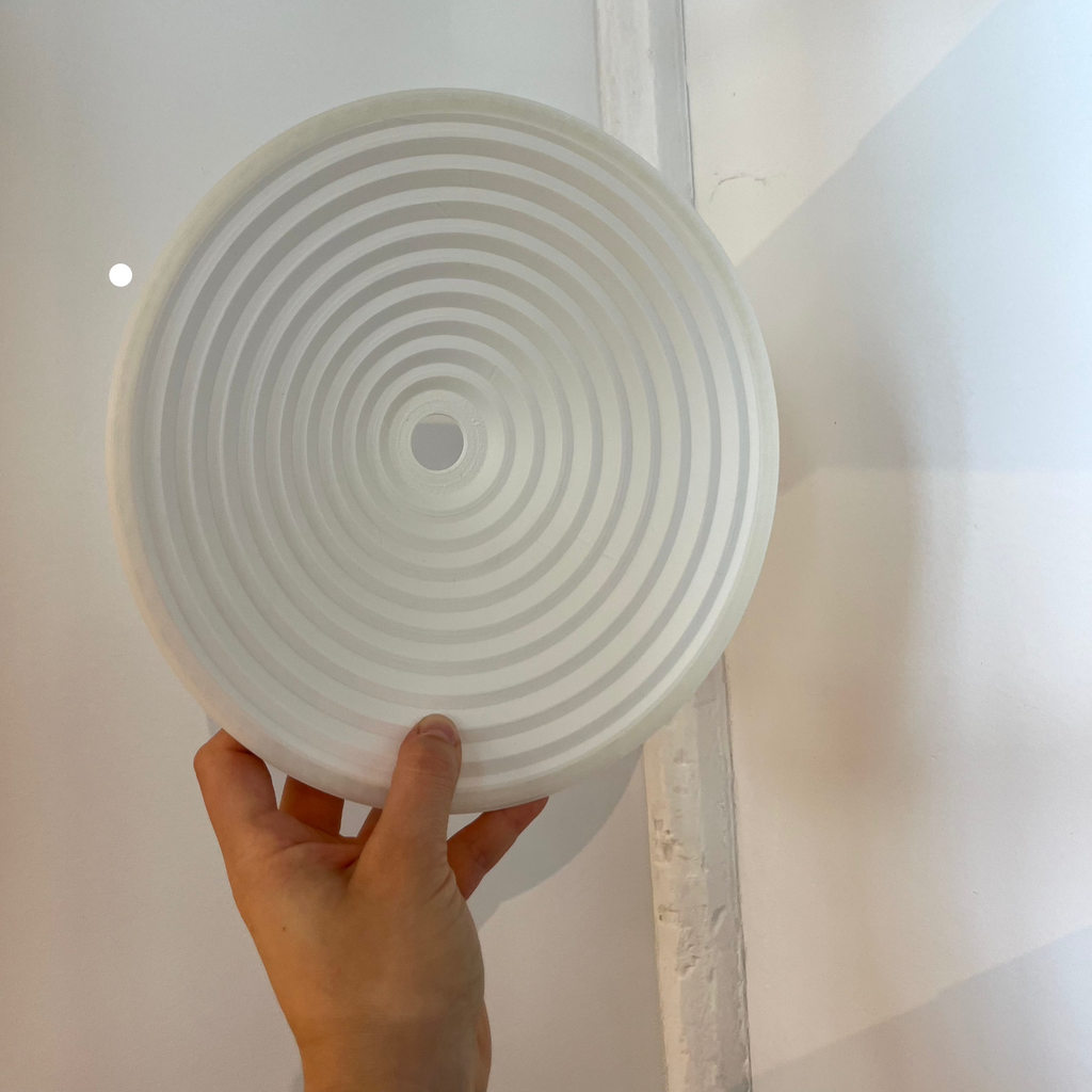 Echo Sconce shade in Eggshell with defect on white background