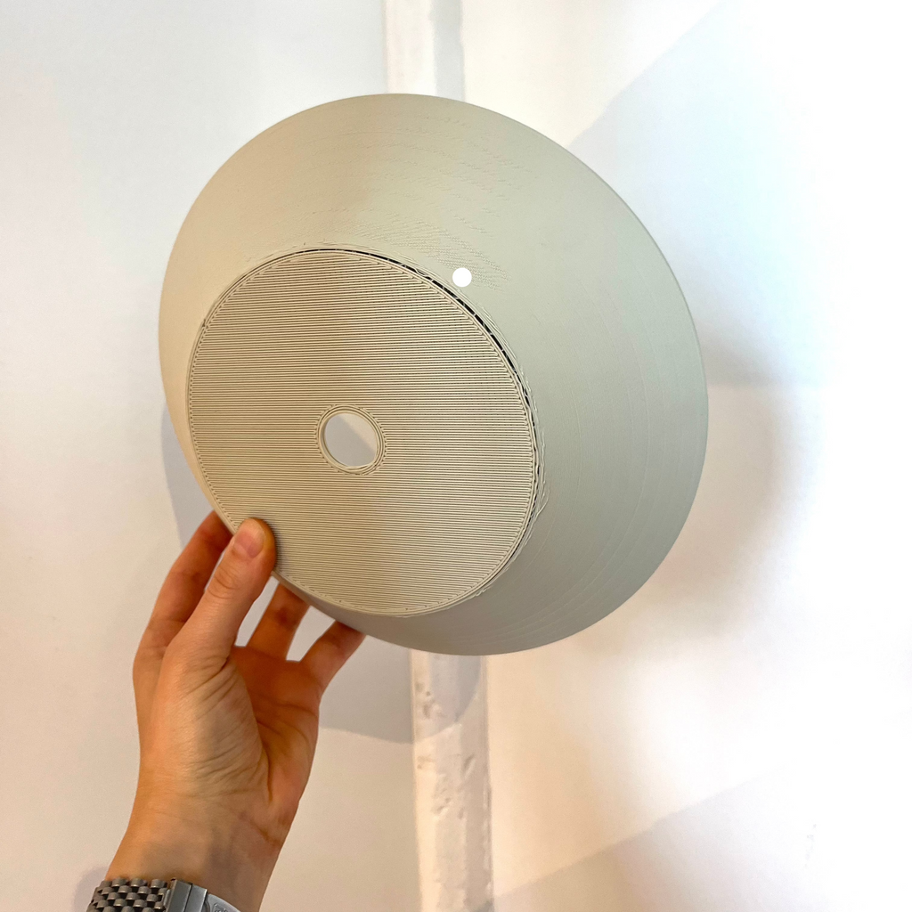 Echo Sconce shade in Eggshell with defect on white background