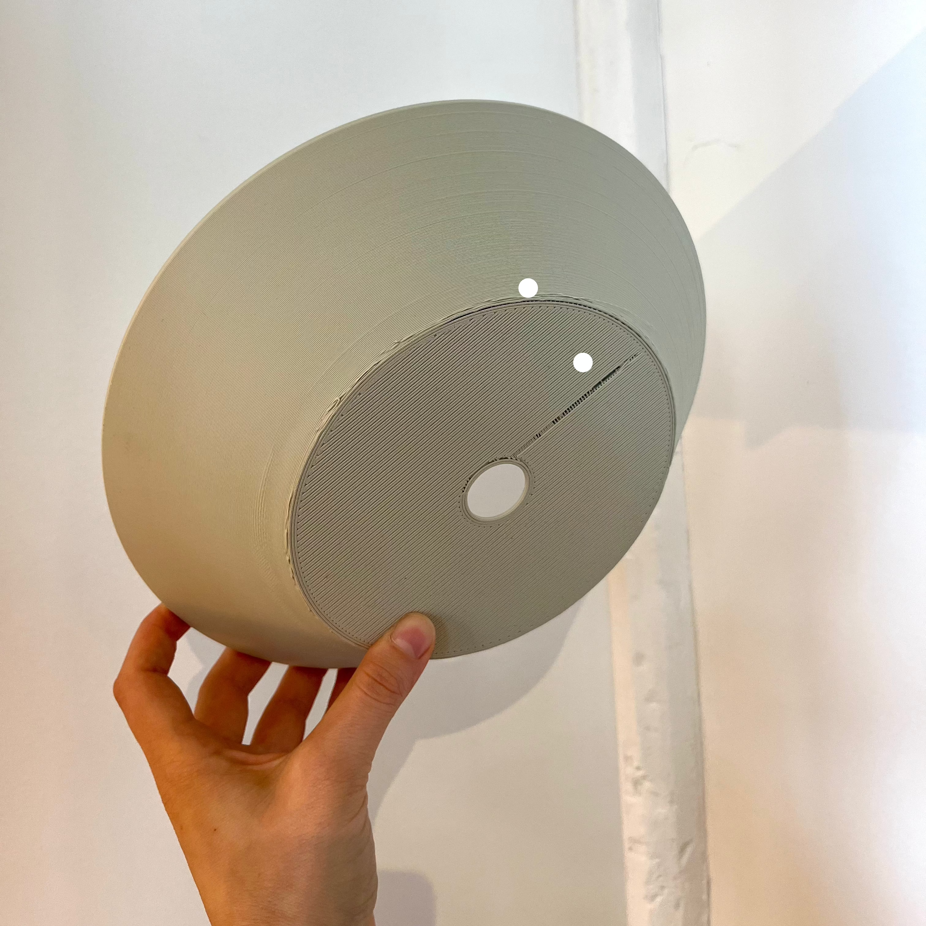 Echo Sconce shade in Eggshell with defect on white background