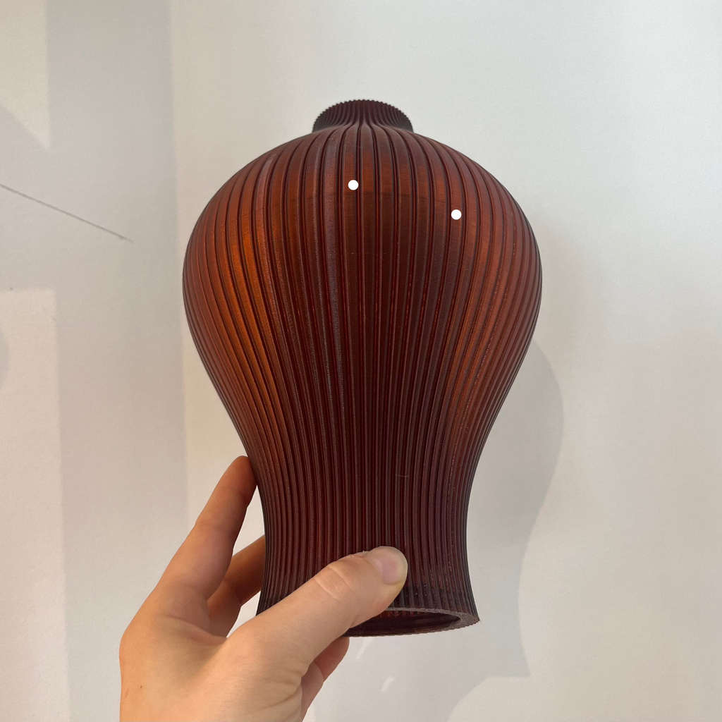 Baleine Lamp in Amber with defect on white background