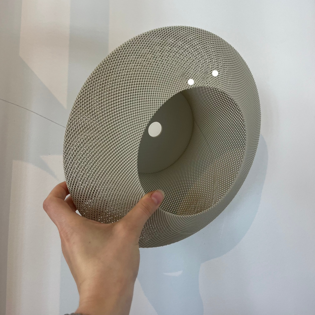 Helios Sconce shade in eggshell with defect on white background