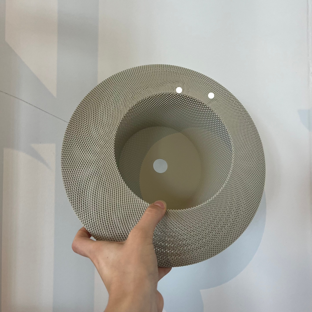 Helios Sconce shade in eggshell with defect on white background