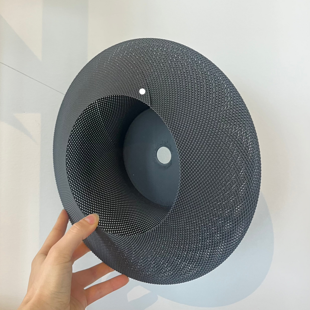 Helios Sconce shade in matte black with defect on white background