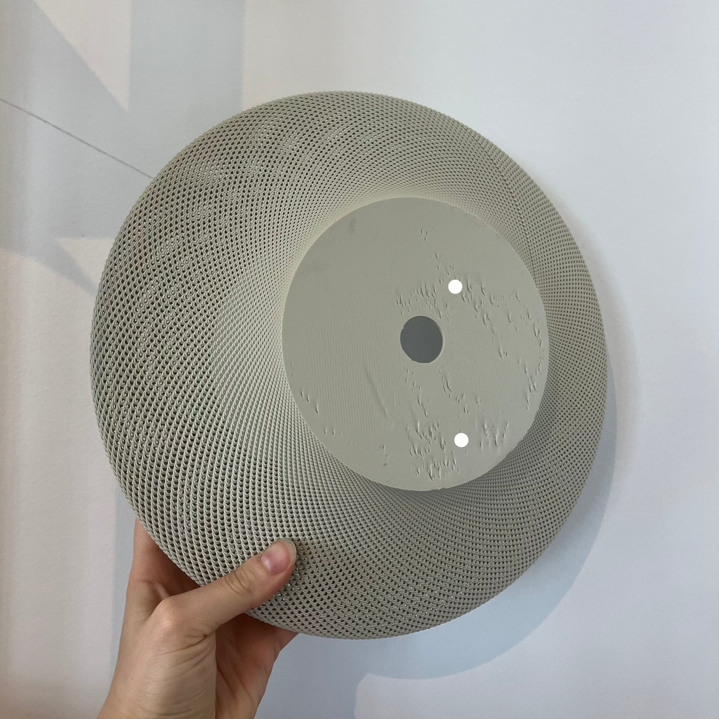 Helios Sconce shade in eggshell with defect on white background