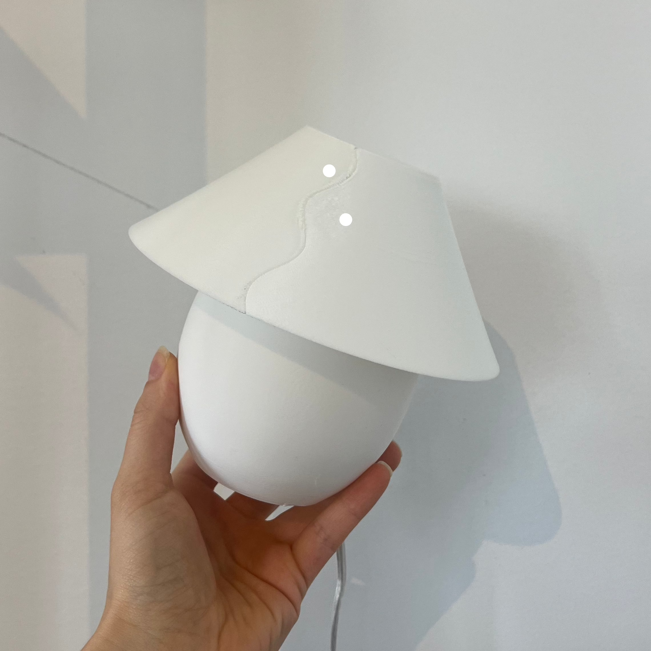 Scoop Lamp in eggshell with defect on white background