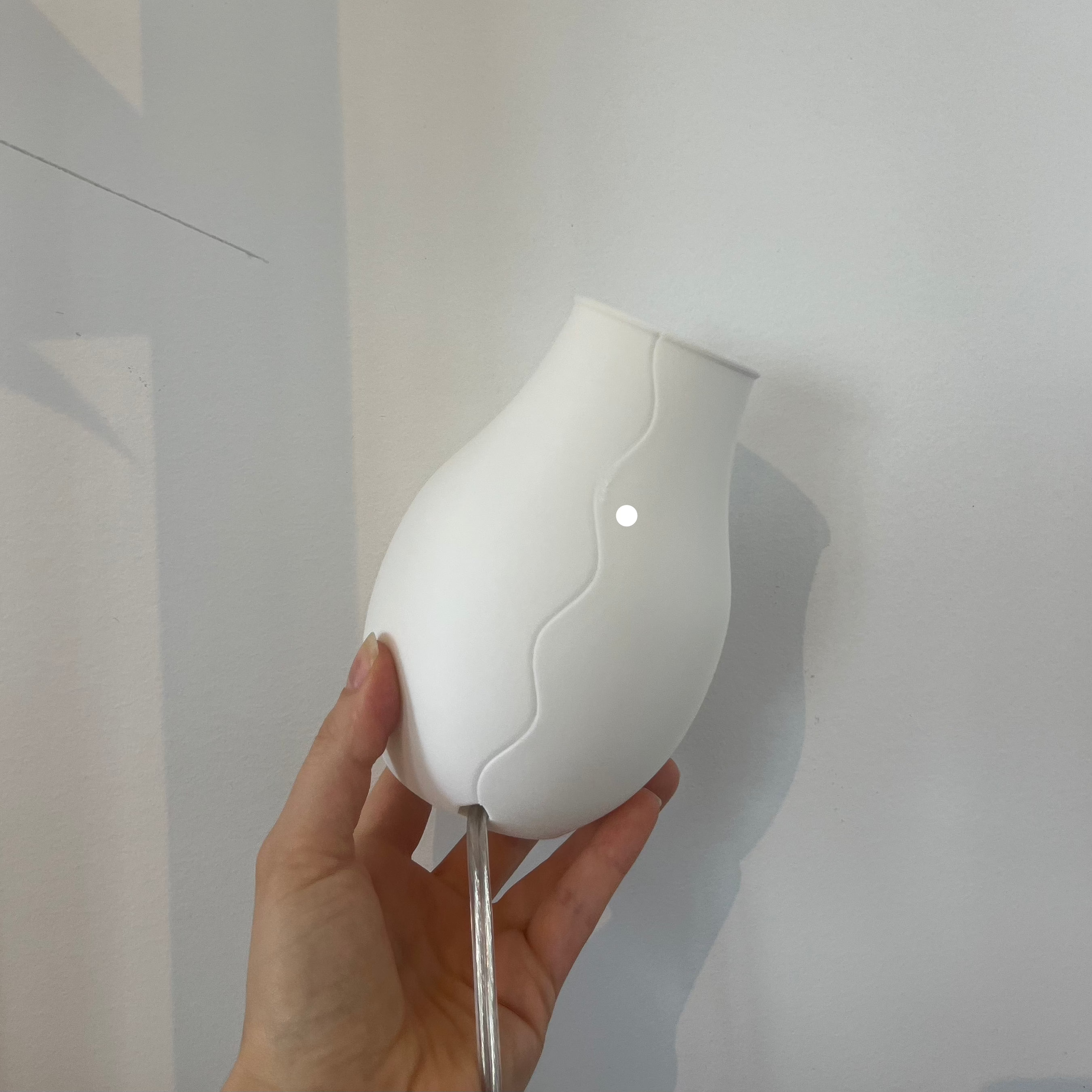 Scoop Lamp in eggshell with defect on white background