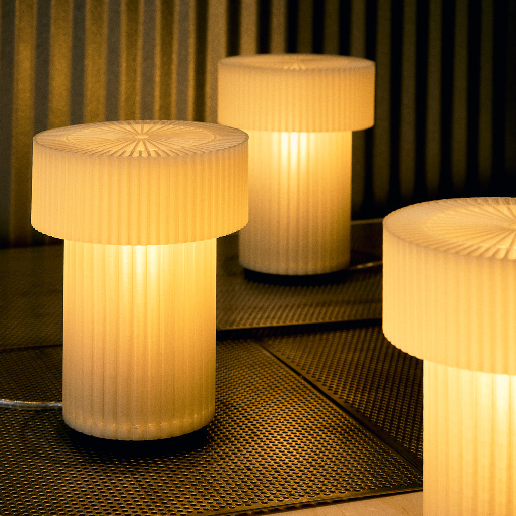Image of several Mini Drum Lamps displaying a cozy glow