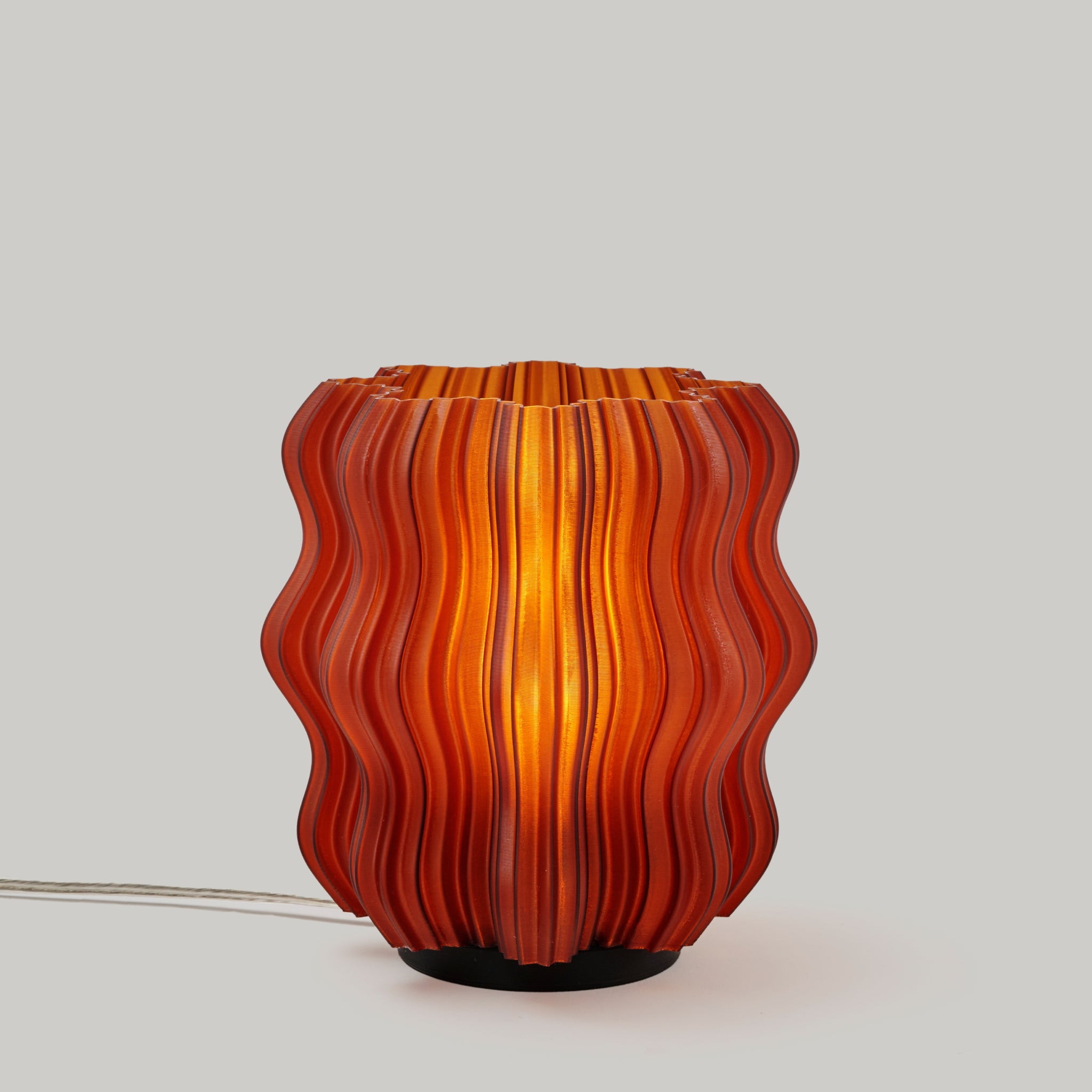 Mini Wavy Lamp in Amber on white background