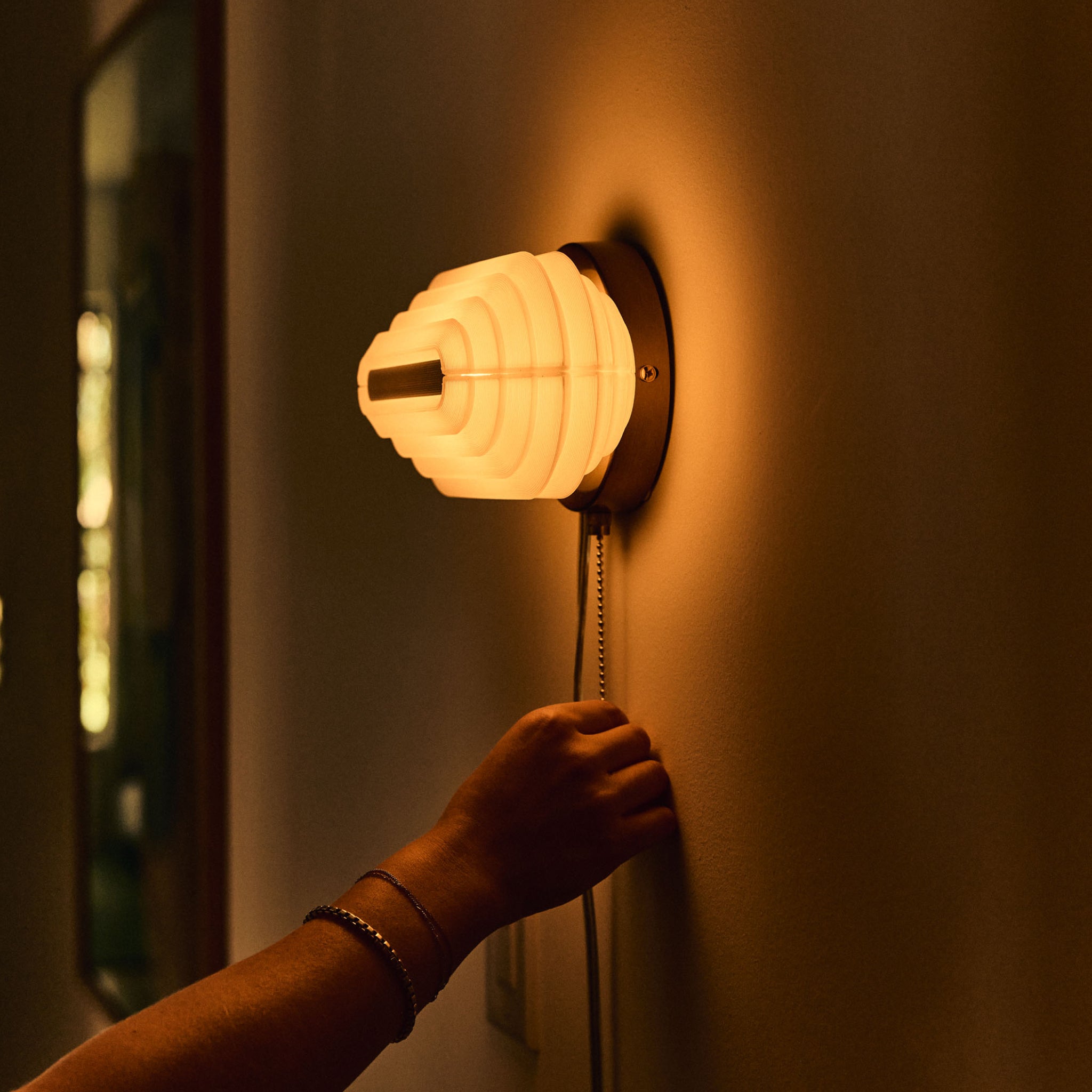 Pill Sconce in horizontal orientation being dimmed
