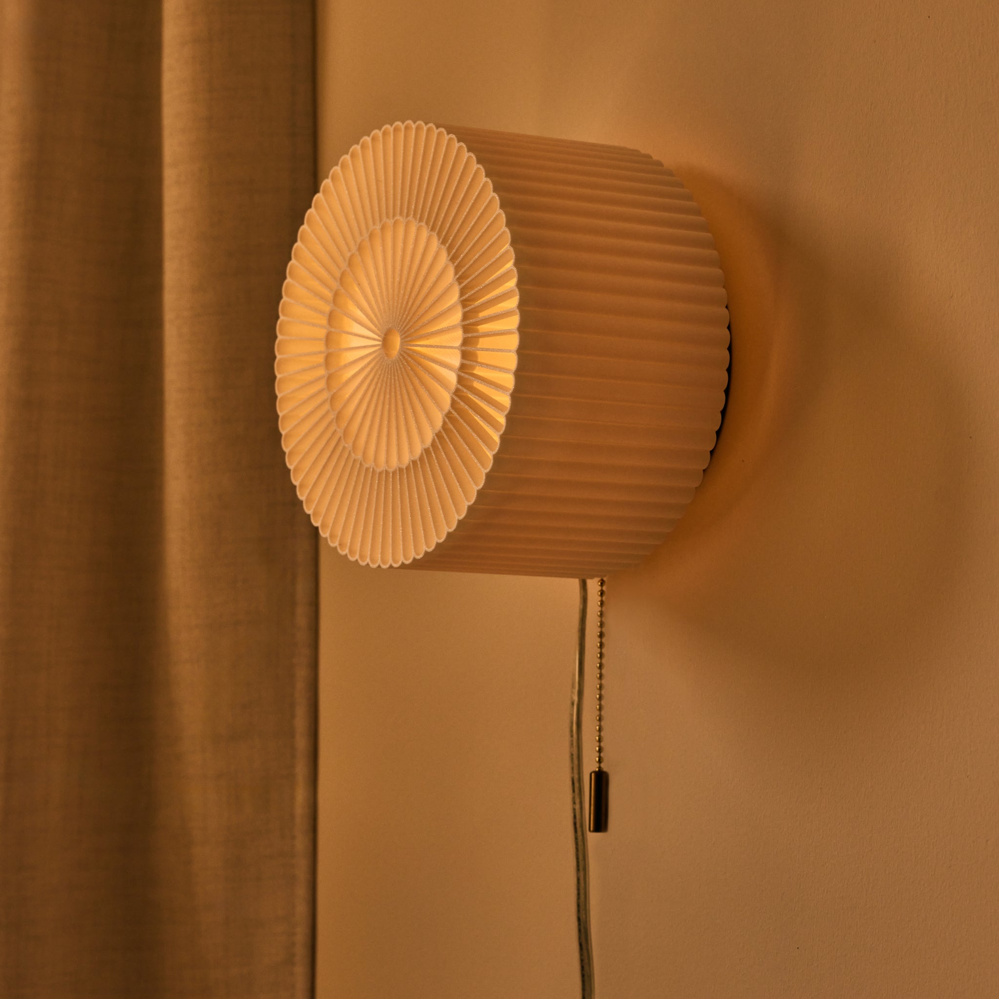 Rosette Sconce in White on wall with curtain