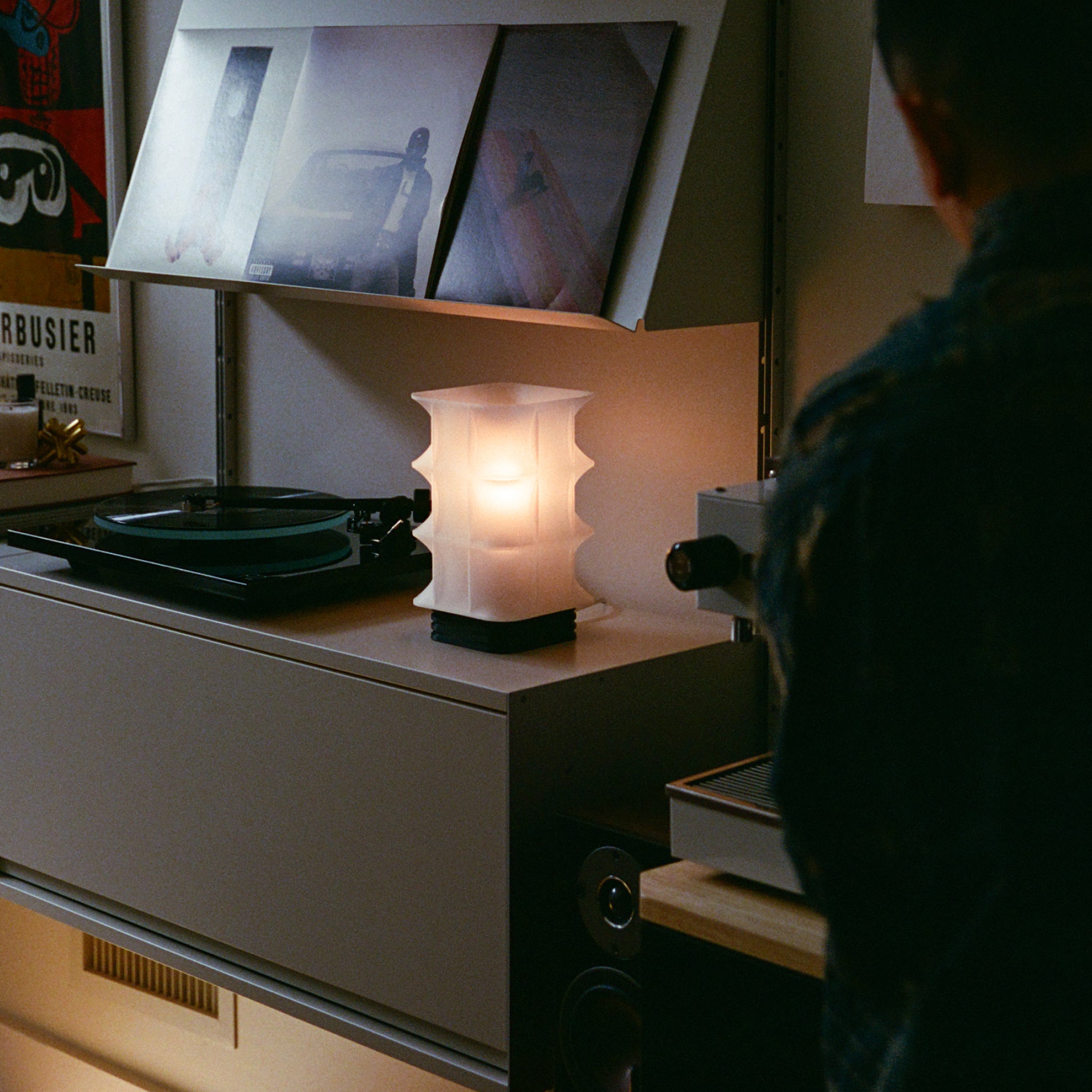 Image of Scaffold Lamp with a nice radiance next to a record player