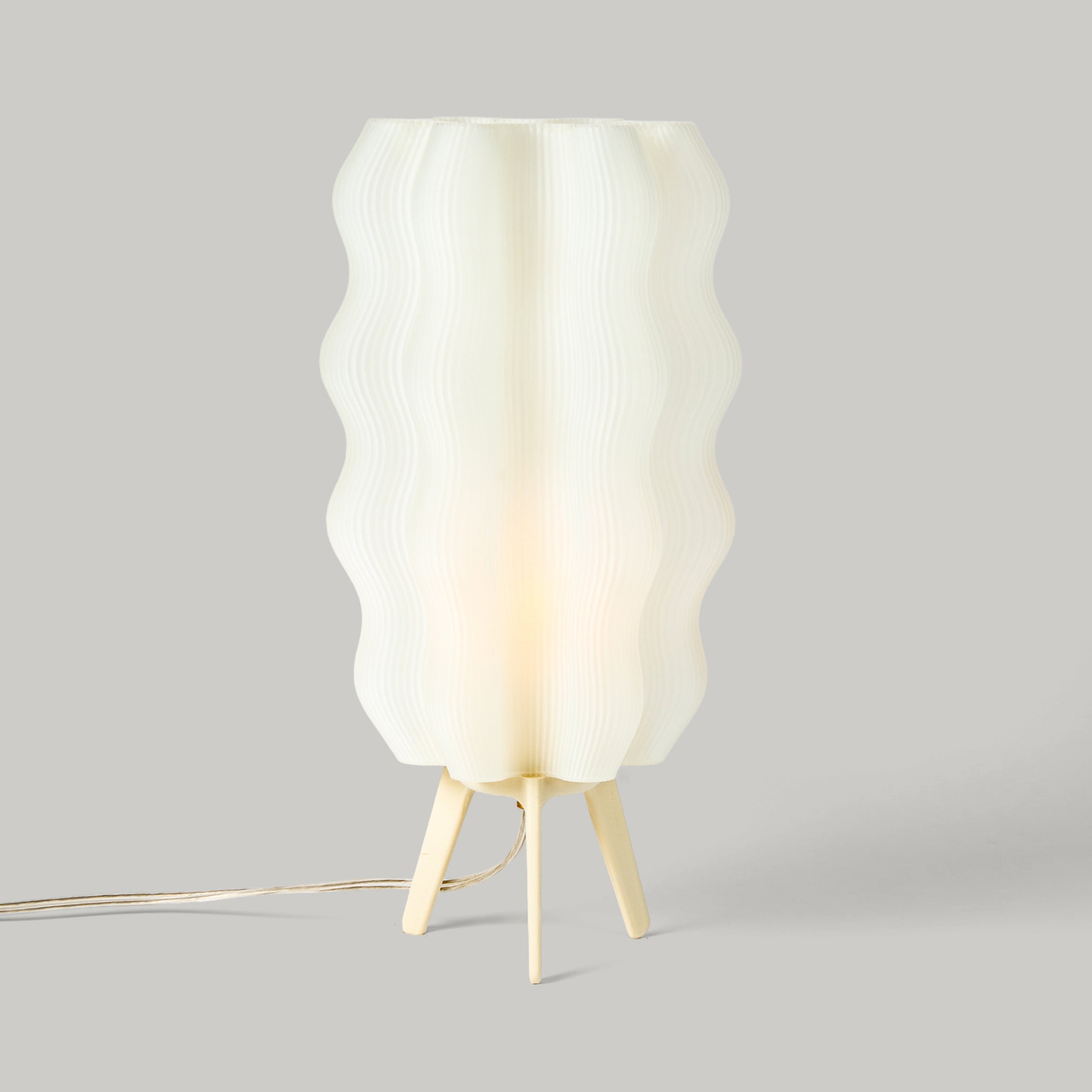 Tall Wavy Lamp in eggshell on white background