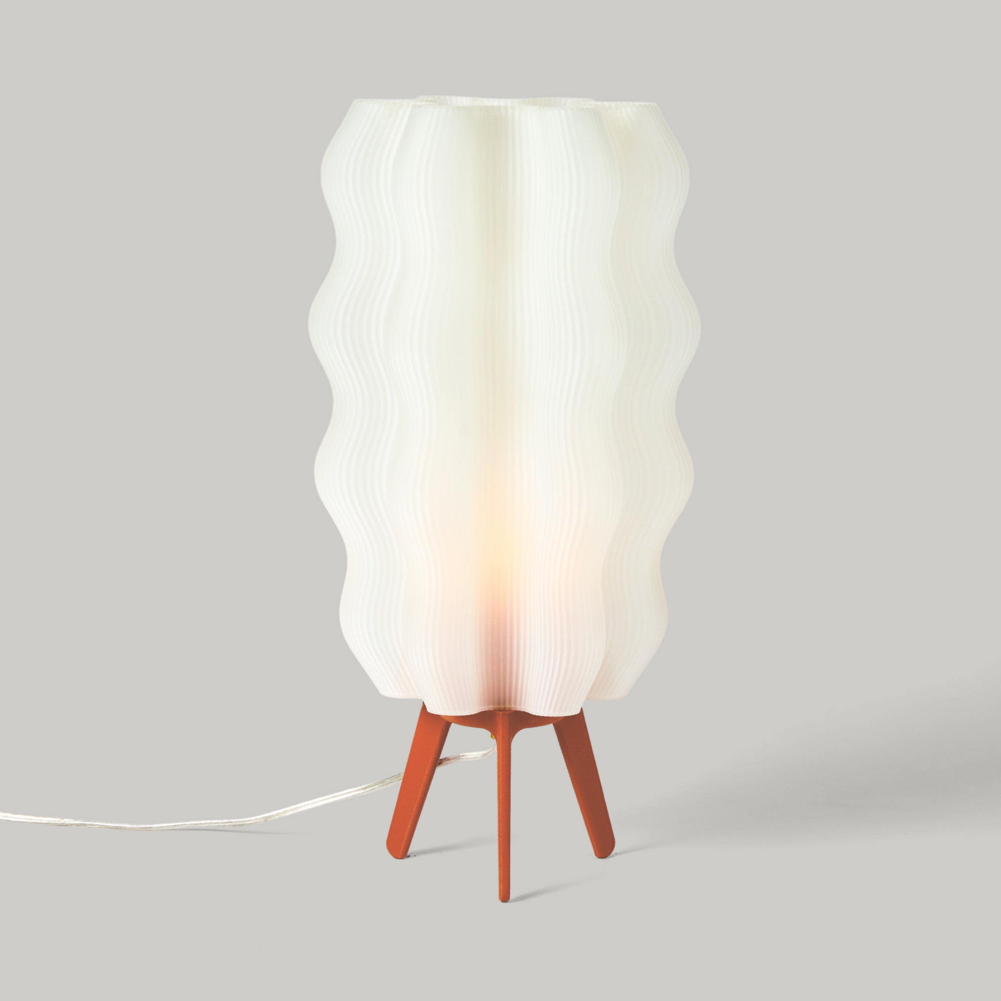 Tall Wavy Lamp in vermillion on white background