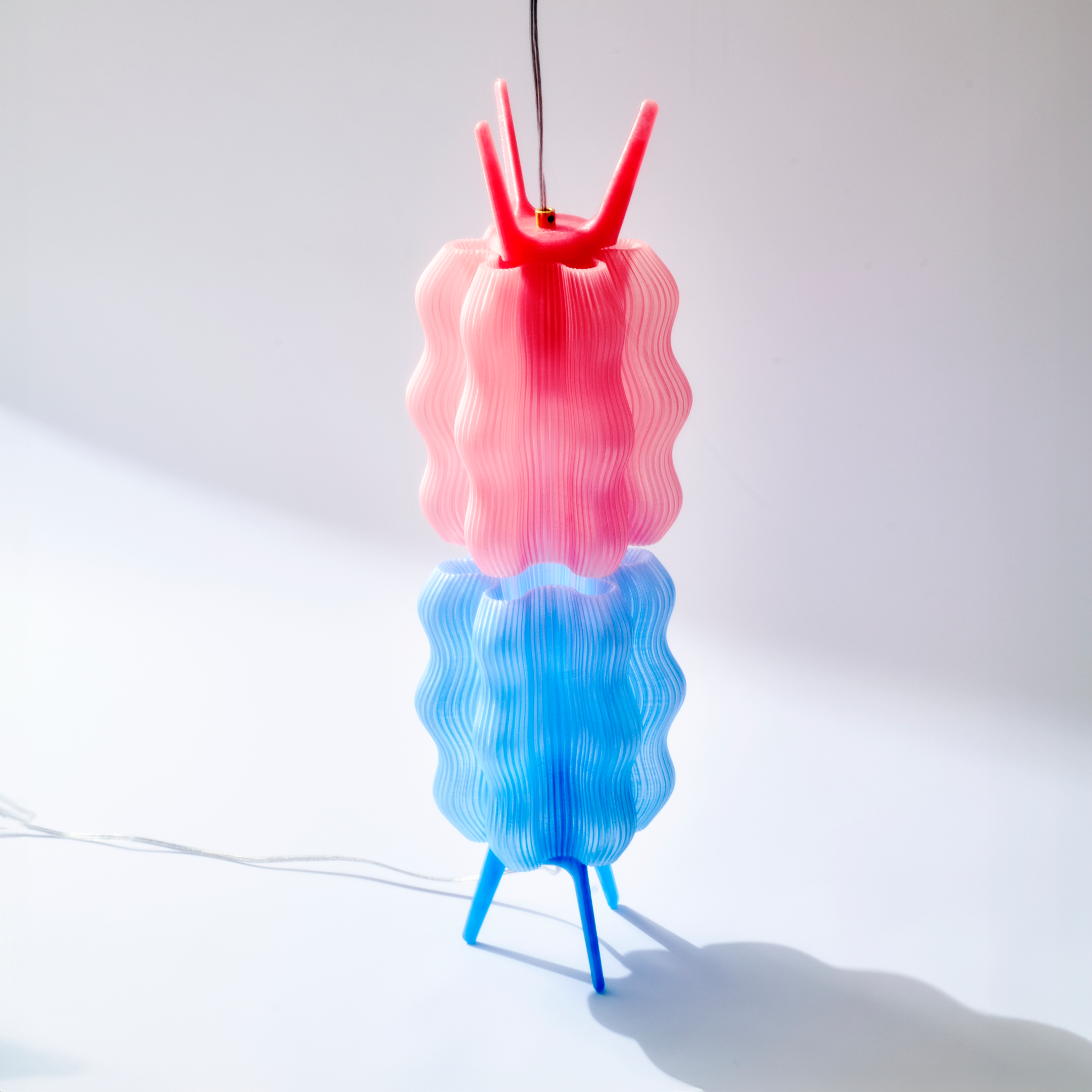 Wavy Lamps in peach and periwinkle stacked