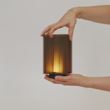 Cordless mini brut lamp shade being removed from base