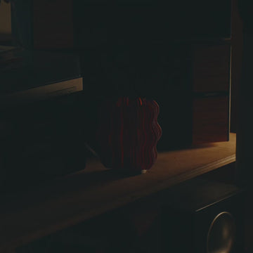 Mini Wavy Lamp in amber on desk