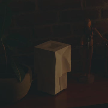 Farolito Lamp on desk turning on