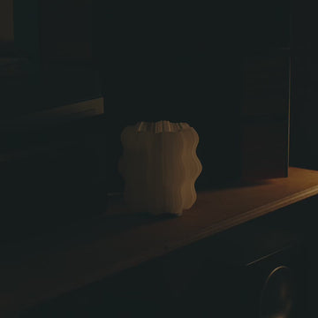 Mini Wavy Lamp in Natural on desk