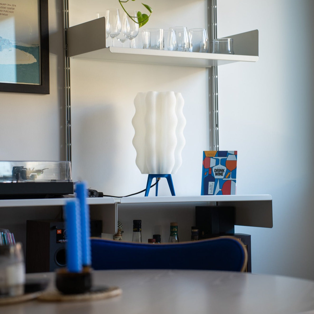 Tall Wavy Lamp in cobalt on bookshelf