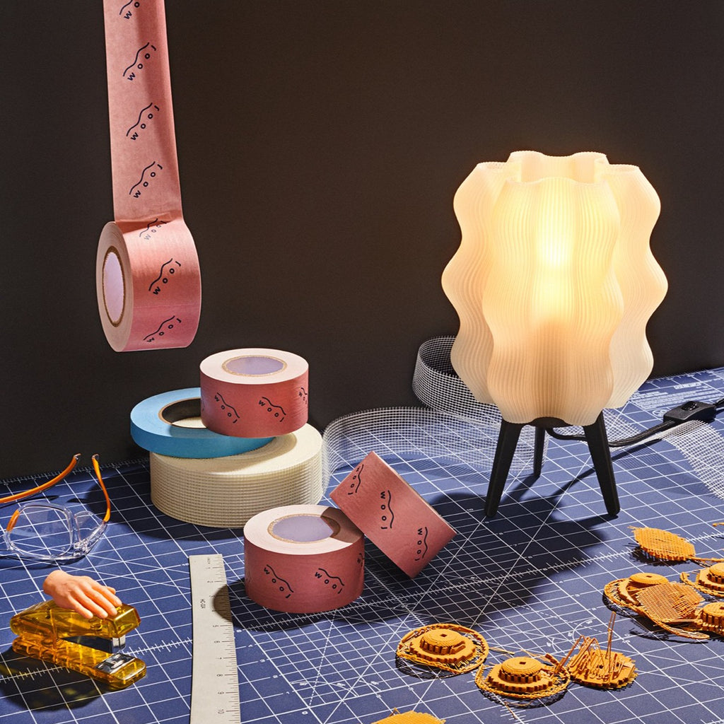 Wavy Lamp in matte black on cutting matte with tape and printer filament