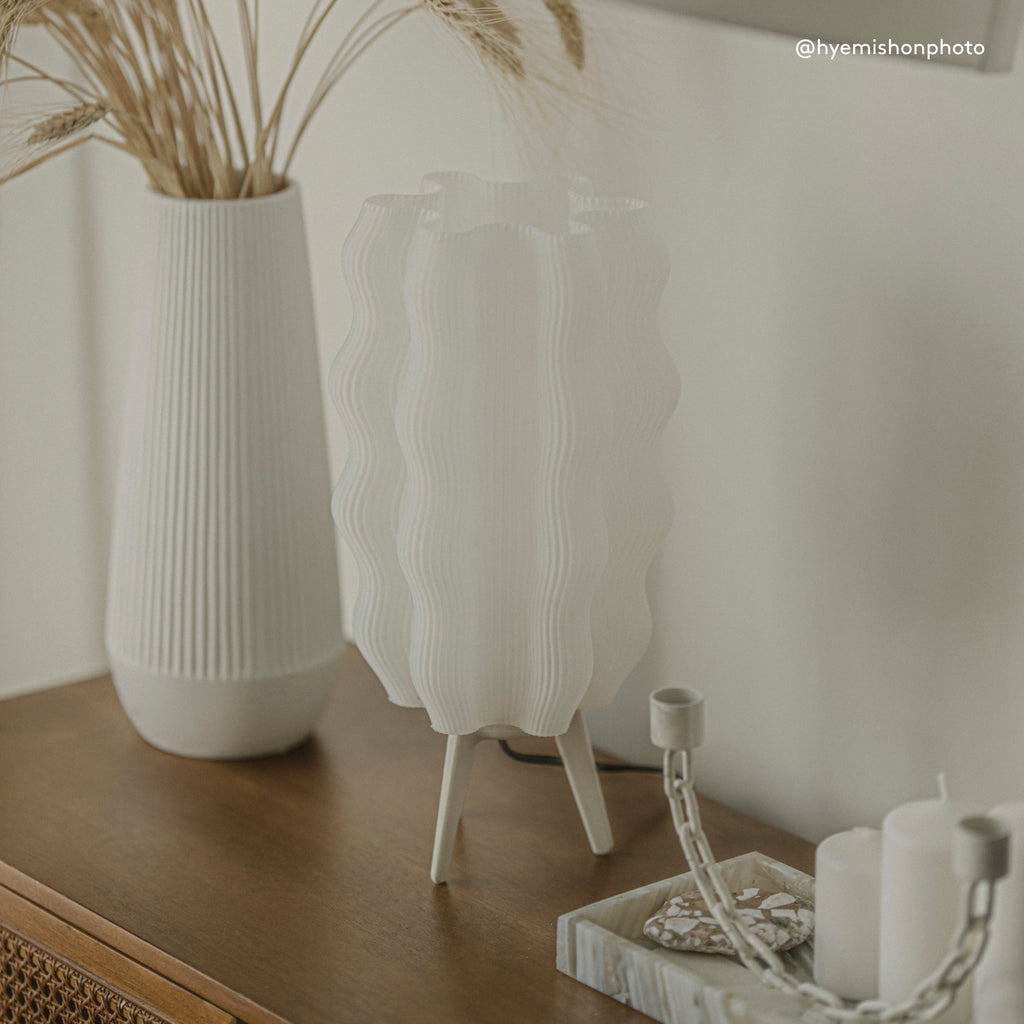 Tall Wavy Lamp in eggshell on side table